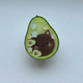 Avocado-shaped object with a cat design on a white background