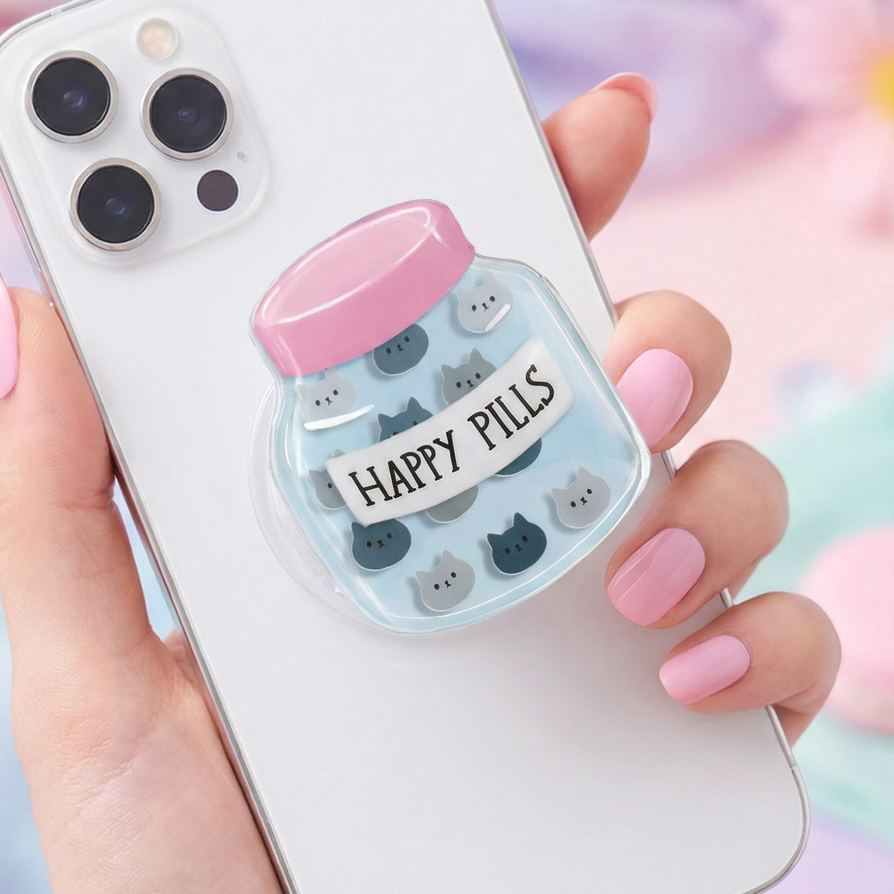 Phone case with 'Happy Pills' design held by a hand against a colorful background