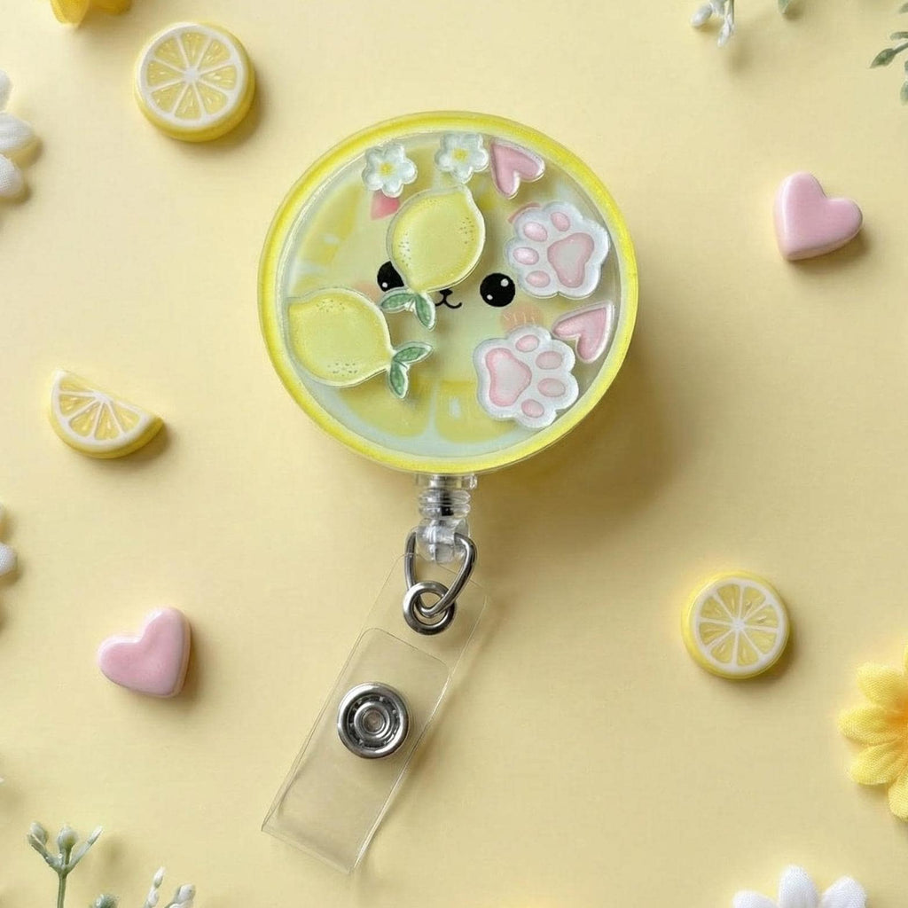 Cute badge reel holder with lemon and paw design on a yellow background